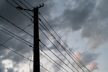 Black wires against the moody sky.