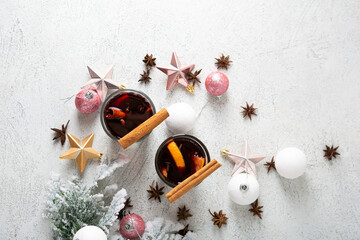 Two glasses of hot wine with spice and fruits winter beverages top view