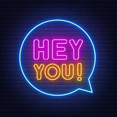 Hey you neon sign on brick wall background.