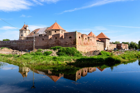 Renovated old historical buildings  of Fagaras Fortress (Cetatea Fagaras) during renovation works in a sunny summer day, in Transylvania (Transilvania) region, Romania  .