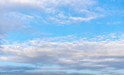 Blue sky and clouds of pastel colors