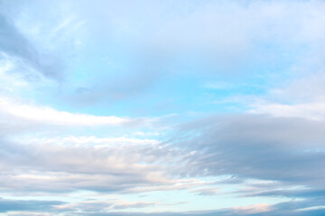 Blue sky and clouds of pastel colors