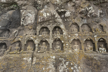 Carved idols of Digambar Jain Tirthankaras on the rock of Mangi Tungi, Nashik, Maharashtra, India.