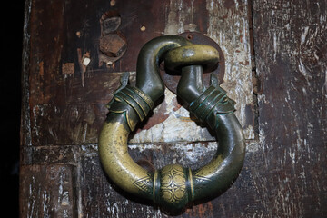 Authentic handle on an antique wooden door at Dambulla cave temple in Sri Lanka