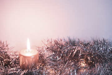 Christmas still card or background.  Copy space with lit candle