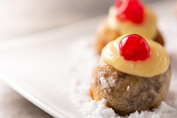 Traditional Italian Zeppole pastry on wooden table