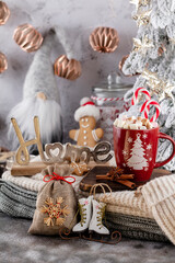 Obraz na płótnie Canvas Gingerbread with mug of hot chocolate and candy cane.