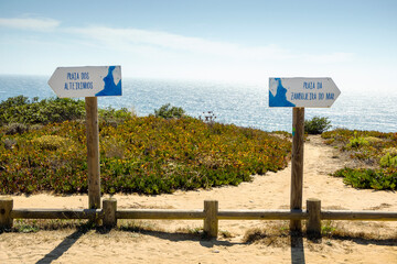 Signposts informing about two beaches called Alteirinhos and Zambujeira do Mar in Portugal