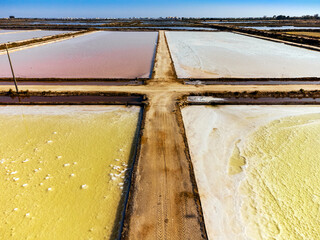 Amazing colors of sea salt ponds called salines shortly before salt harvest in Portugal