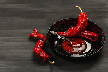 Ripe hot chili pepper on wooden boards background