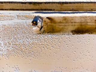 Obraz premium Aerial view of sea salt harvest at the salines in Portugal