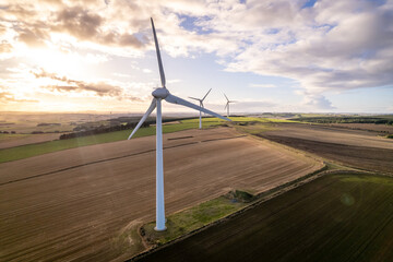 A Wind Turbine on a Green Renewable Energy Farm on a Sunny Day