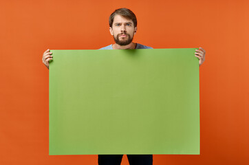 emotional man holding a green banner design studio lifestyle