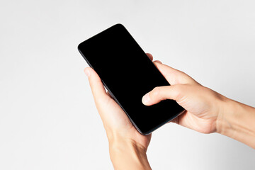 Woman holding smartphone with black screen