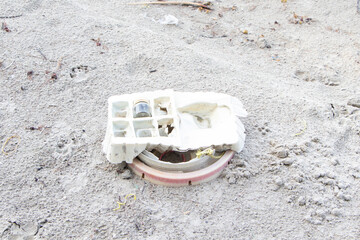 Paper crate and glass bottle Garbage that merchant ships dumped into sea during their voyage was washed by the wind and washed up on sandy beach. Environmental pollution. Ecological problem.