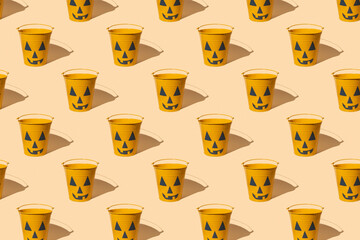 Seamless pattern with Halloween pot on yellow background.