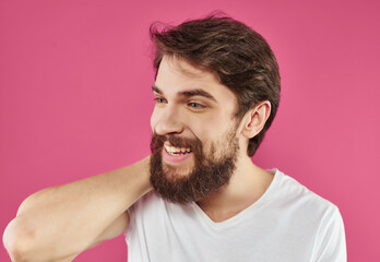 emotional man in a white t-shirt hand gestures Studio