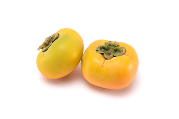 Sweet fresh ripe persimmons isolated on white background