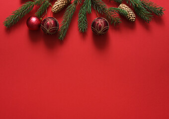 Red Christmas background with fir and ball. New Year card. Present.