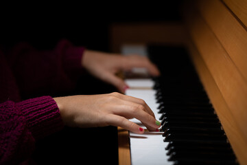 Fototapeta premium Hands of a girl playing the piano