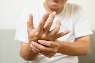 Close up,asian middle-aged man with shaking of Parkinson's disease,symptom of resting tremor,male...