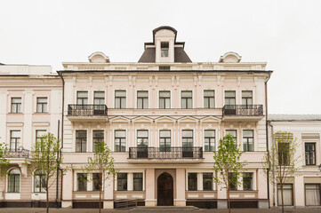 A very old, well-preserved building with balconies in the classical style, equipped with a ramp for few mobile citizens.
