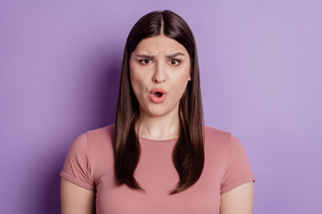 Fototapeta premium Portrait of impressed angry mad amazed shocked brunette girl open mouth isolated on violet background