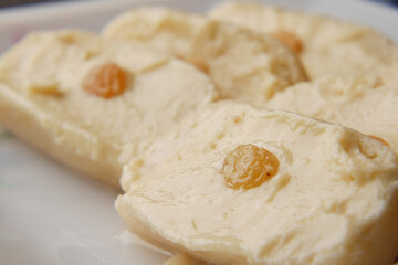 close up of indian sweet in a bowl on table.