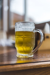 glass glass with light beer on the table
