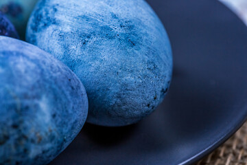 Close-up of blue easter eggs painted with natural dyes