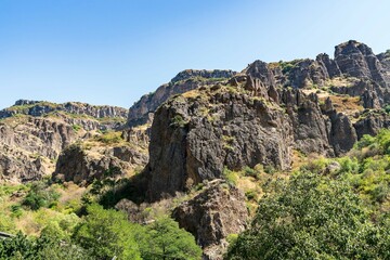 Fototapeta na wymiar Memorial crosses set high in the mountains near Geghard monastery, Armenia.