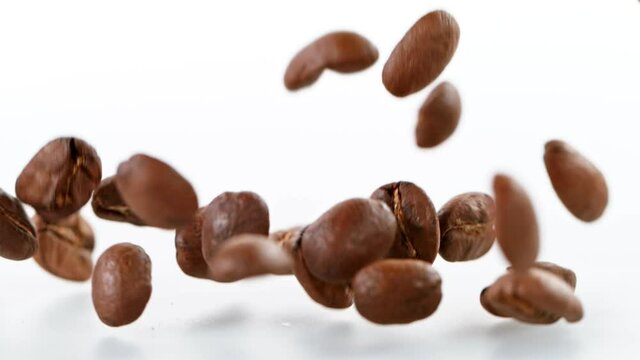 Coffee beans fall. Super slow motion at 1000 fps, filmed on high speed cinematic camera.