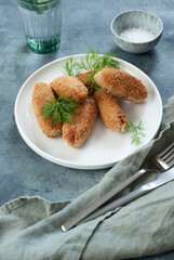 Mushroom and cheese croquettes on a white plate