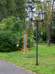 A mechanical exercise machine for physical education in a city park.