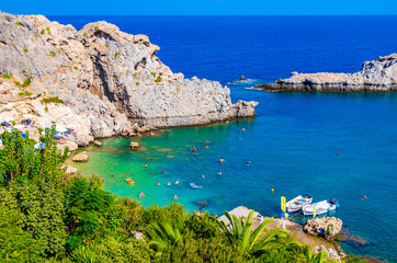 St Pauls Bay panorama with clear water Lindos Rhodes Greece.