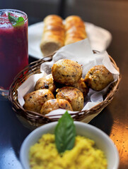 fried chicken balls in a basket, chicken snack with side dishes