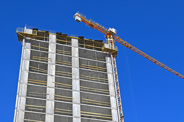 Crane and highrise construction site