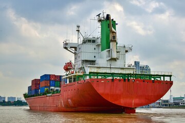 Large container cargo ship in the Chao Phraya River canal
