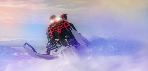 snowmobilers - extreme. the concept of advertising mountain and professional snowmobile driving. a...