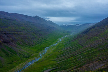 Aerial view on the river in between the mountain in Iceland