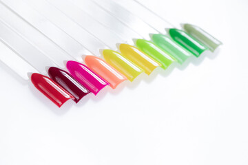Multiсolor nail tips on a white background. examples of manicure for nails. Palette with color samples of nail. Copy space