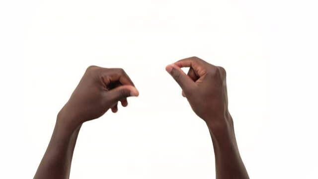 Close up of a black man's hands, snapping his fingers. Isolated on a white background.