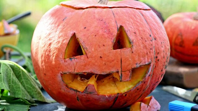 Halloween pumpkin on table. carved pumpkin or jack-o-lantern. Halloween decoration. Funny pumpkin face. Preparing to halloween.