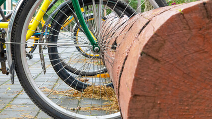 Rustic bike rack. Bicycle Parking Stand Made From the Trunk. bicycle parking was made from a large log.