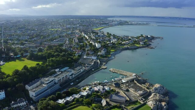 Bullock Harbour, Dalkey, Dublin, Ireland, September 2021. Drone gradually orbits from the east towards Castle Park School with Sandycove and D&uacute;n Laoghaire in the background.