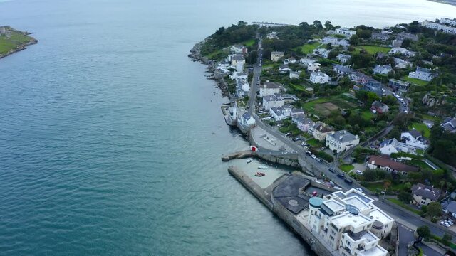 Coliemore Harbour, Dalkey, Dublin, Ireland, September 2021. Drone gradually orbits from the north at a higher altitude revealing the view south along the Dalkey coastline.