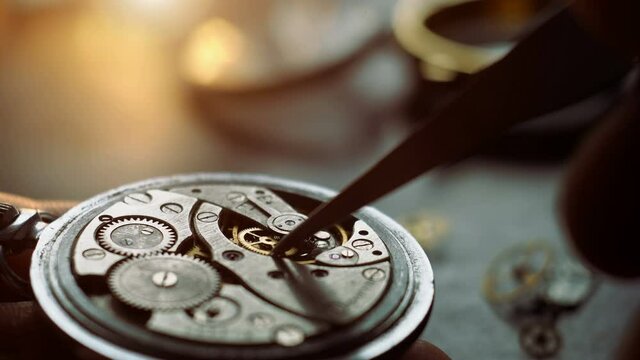 Mechanical watch repair. Watchmaker is repairing wristwatch