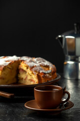 A cup of coffee with homemade apple pie