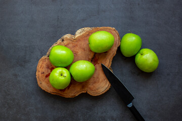 Fresh green jujube fruit isolated on dark background