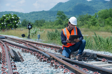 worker on a railroad.   engineer sitting on railway inspection. construction worker on railways. Engineer work on railway.rail,engineer,Infrastructure